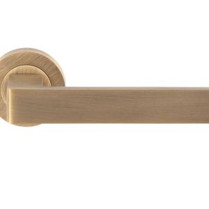 Sasso Door Handles On Round Rose, Antique Brass (sold in pairs)