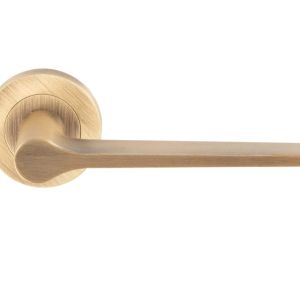 Velino Door Handles On Round Rose, Antique Brass (sold in pairs)
