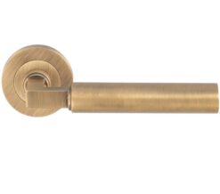 Amiata Door Handles On Round Rose, Antique Brass (sold in pairs)