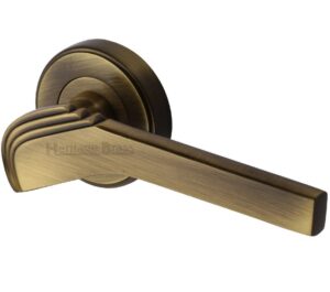 Heritage Brass Tiffany Art Deco Style Door Handles On Round Rose, Antique Brass (sold in pairs)