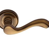 Heritage Brass Lisboa Antique Brass Door Handles On Round Rose  (sold in pairs)