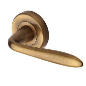 Heritage Brass Sutton Antique Brass Door Handles On Round Rose  (sold in pairs)