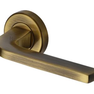 Heritage Brass Bellagio Antique Brass Door Handles On Round Rose (sold in pairs)