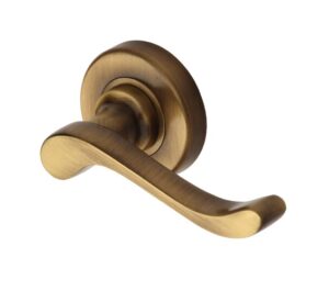 Heritage Brass Bedford Antique Brass Door Handles On Round Rose  (sold in pairs)