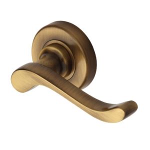 Heritage Brass Bedford Antique Brass Door Handles On Round Rose –   (sold in pairs)