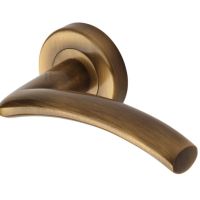 Heritage Brass Centaur Antique Brass Door Handles On Round Rose –   (sold in pairs)