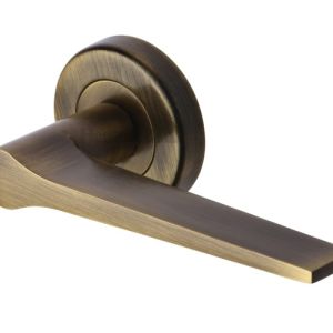Heritage Brass Gio Antique Brass Door Handles On Round Rose (sold in pairs)